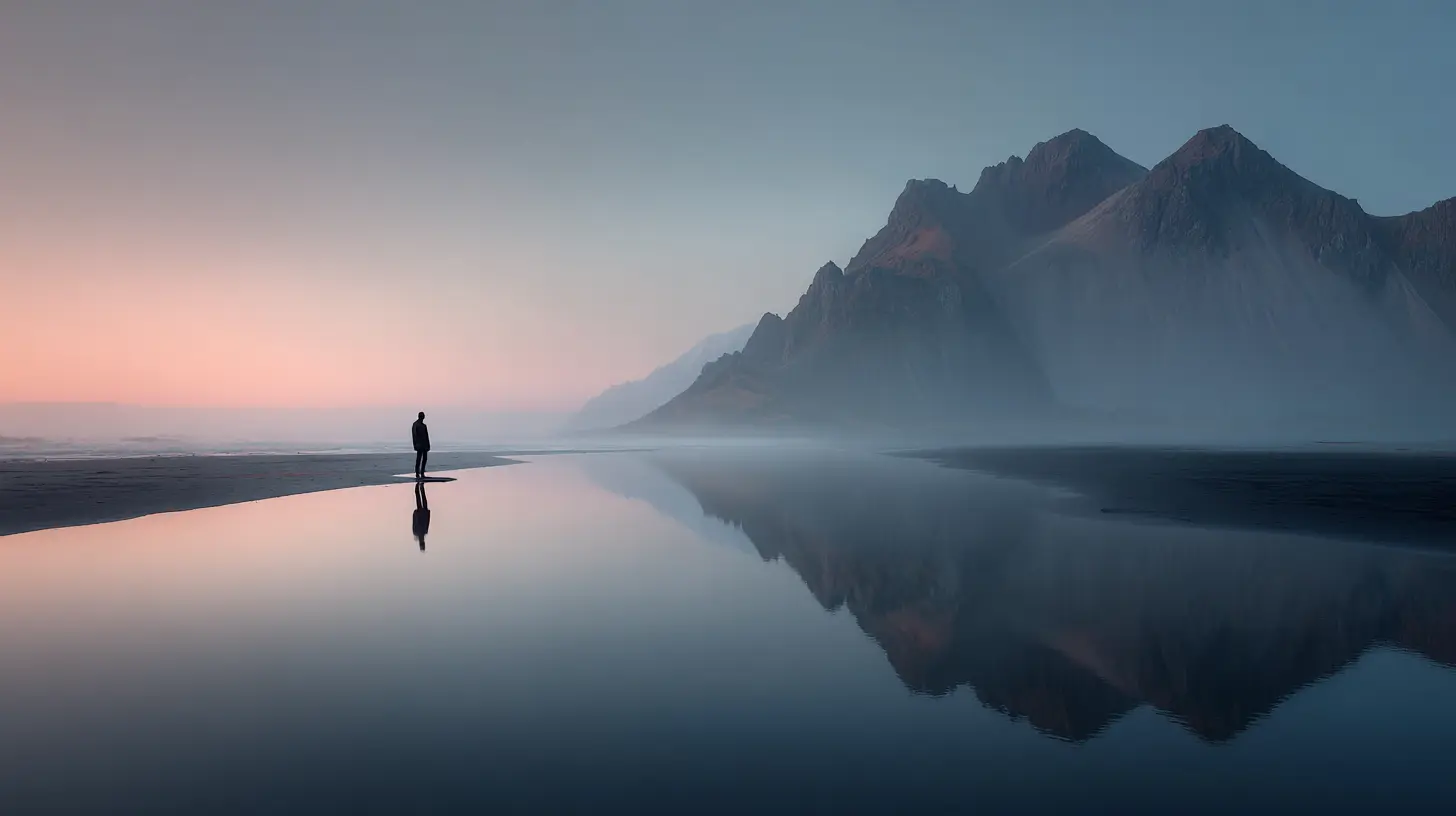A lone person standing by the sea at sunrise, symbolizing peace, clarity, and acceptance found in solitude.